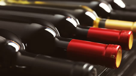 Wine bottles arranged in rows, from the ITALSEMPIONE parent-company profile