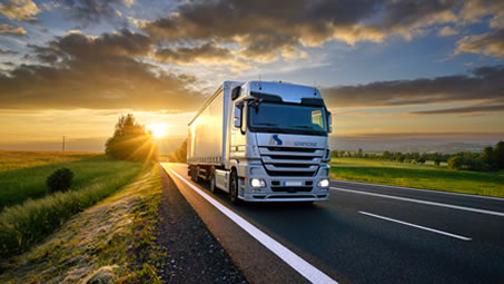 Truck on a country road at sunset, from the ITALSEMPIONE parent-company profile
